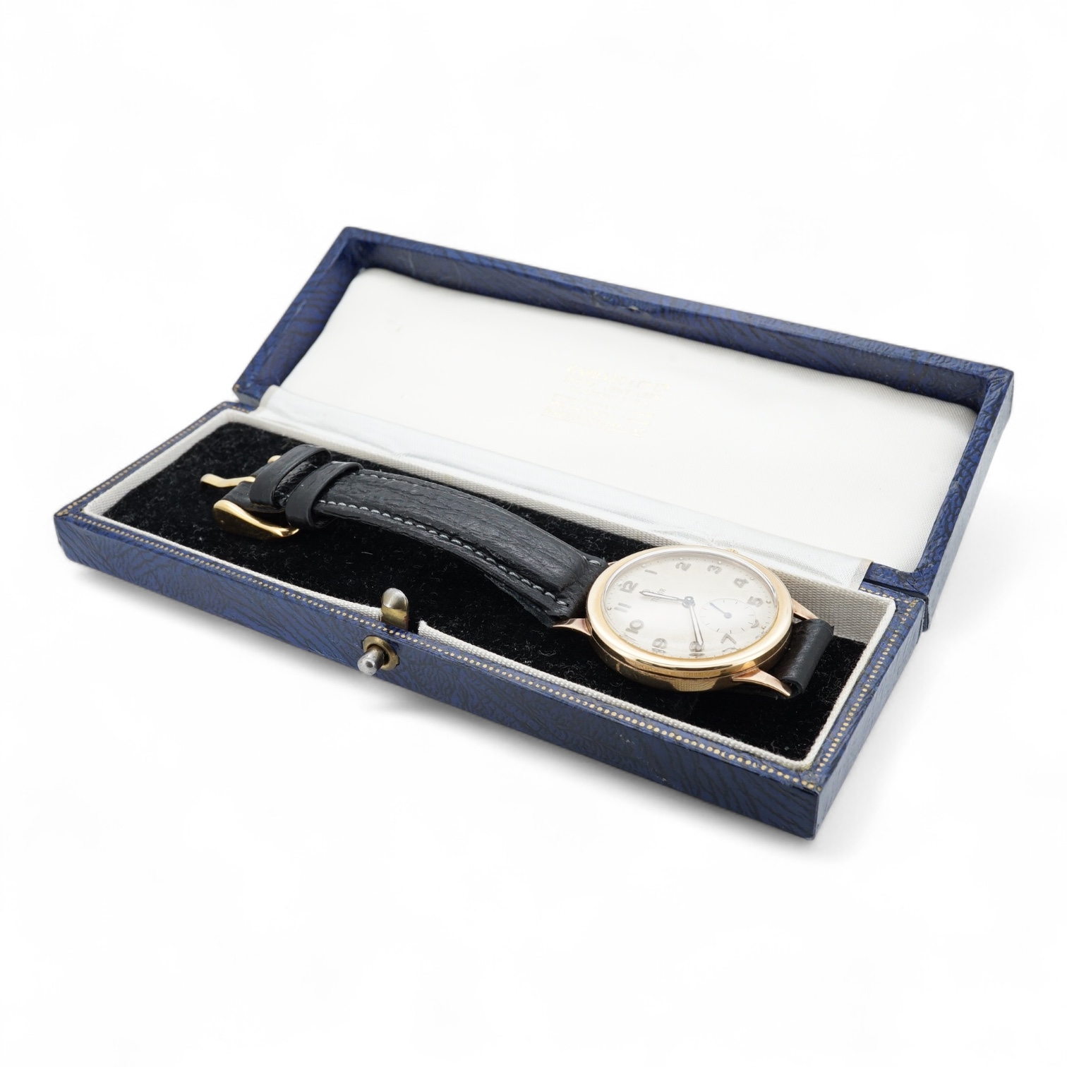 A gentleman's 9ct gold Tudor manual wind wrist watch, with Arabic numerals and subsidiary seconds, case diameter 32mm, on an associated leather strap, with a Garrards box.